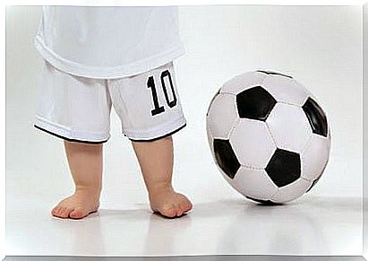 barefoot babies with soccer ball