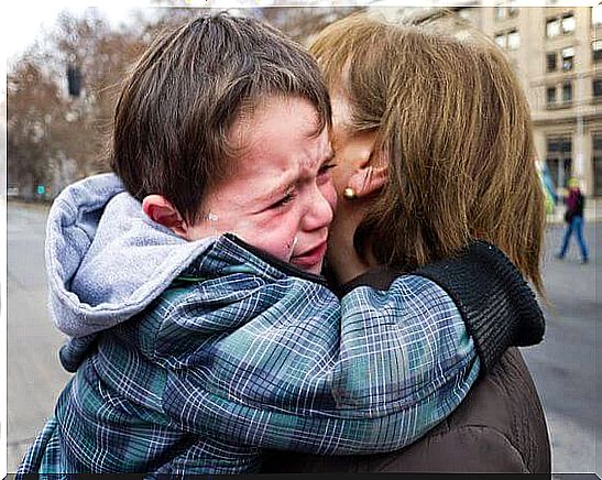 To say goodbye - boy is crying in mom's arms