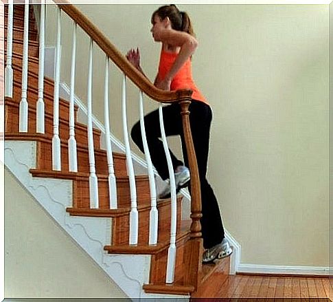 Woman goes up the stairs