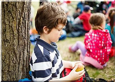 Friends - child eating an apple alone