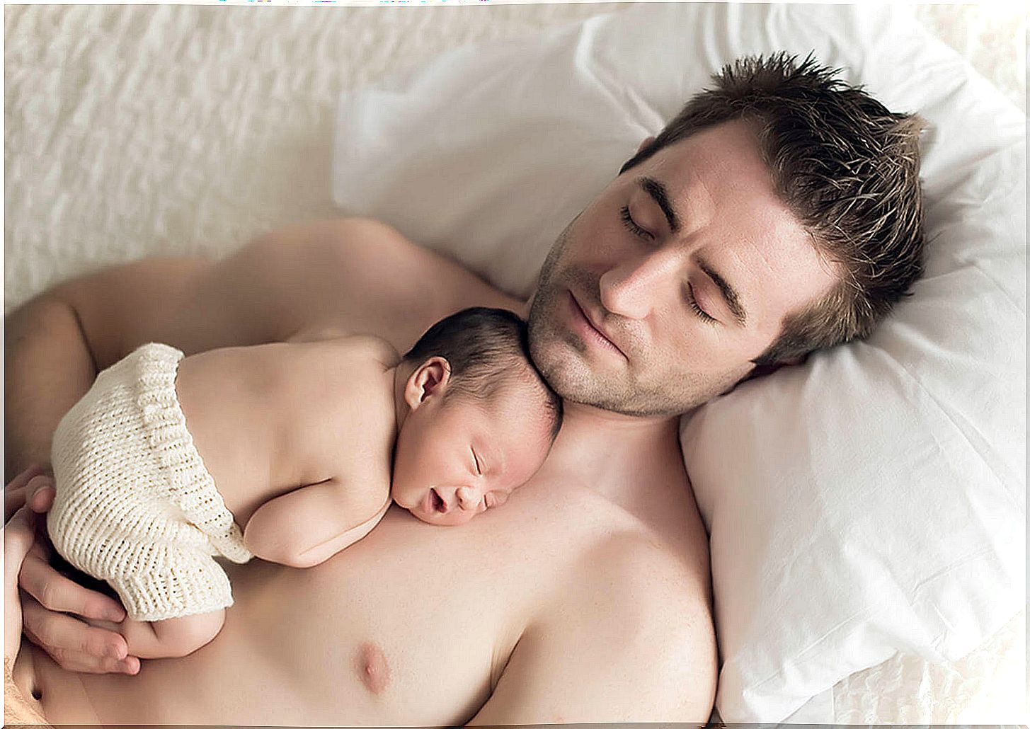 In dad's arms and on his skin: a wonderful place to grow up