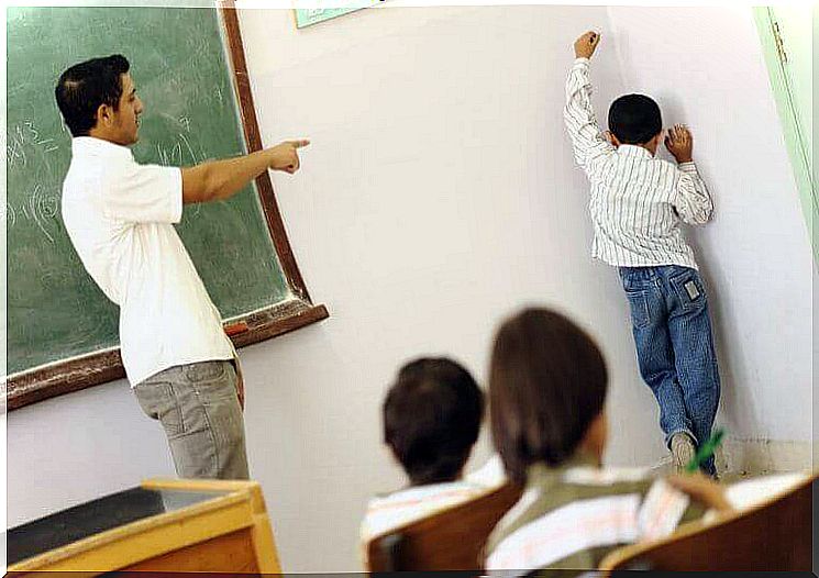 Regulatory measures - boy stands in the corner of the class